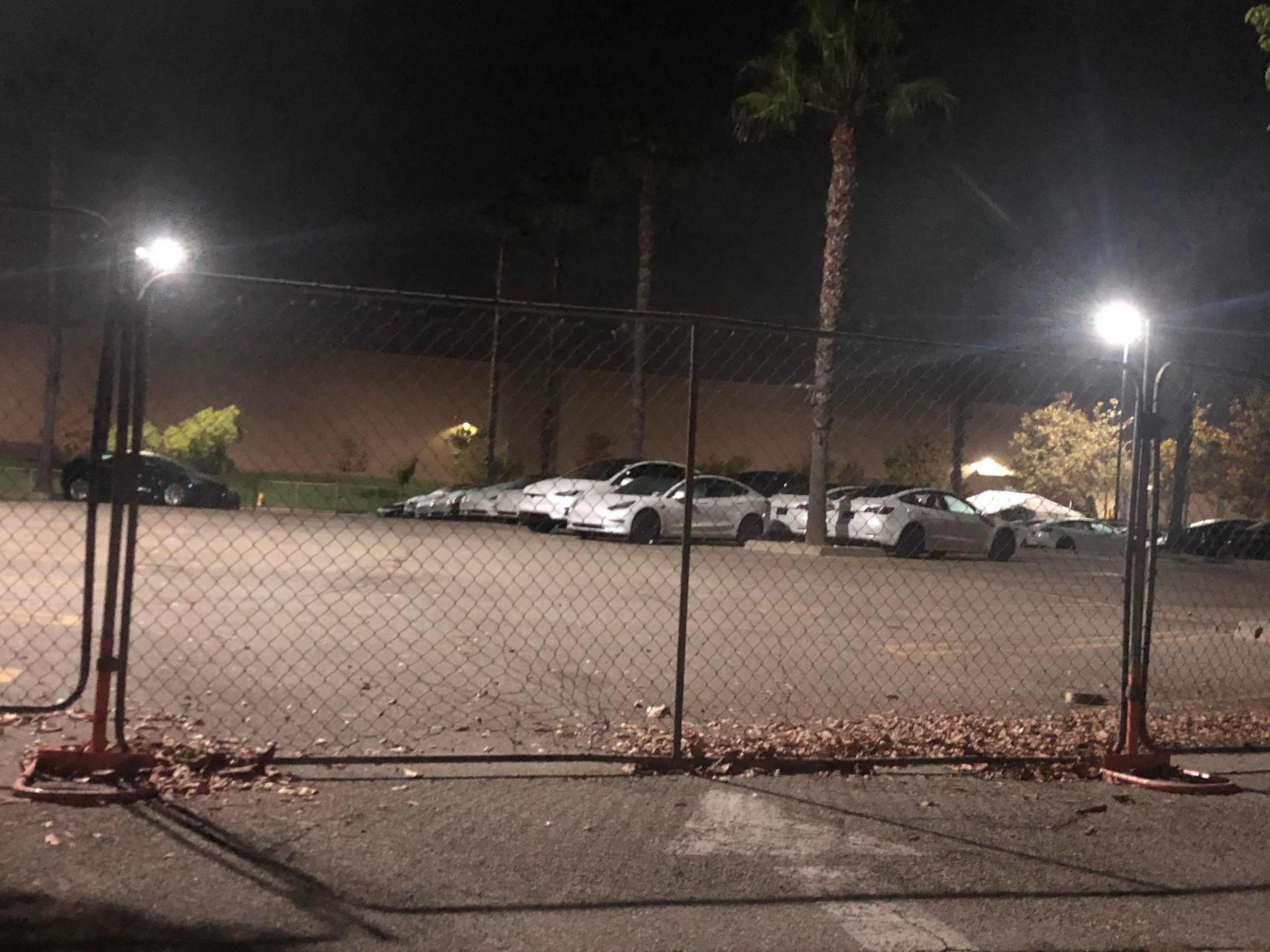 Why are there so many Teslas in this empty parking lot? In the downtown ...